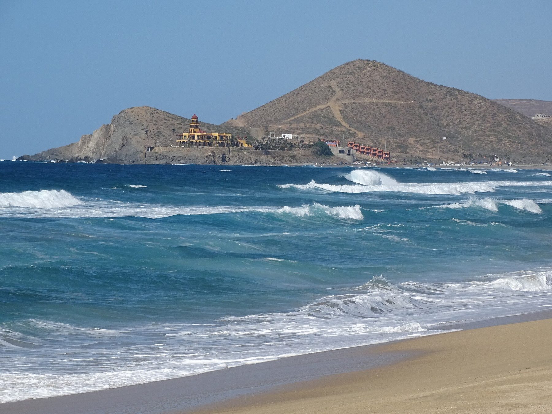 Cerritos Beach Pacific coastline Baja with swimmable surf break and golden sand stretching to the horizon