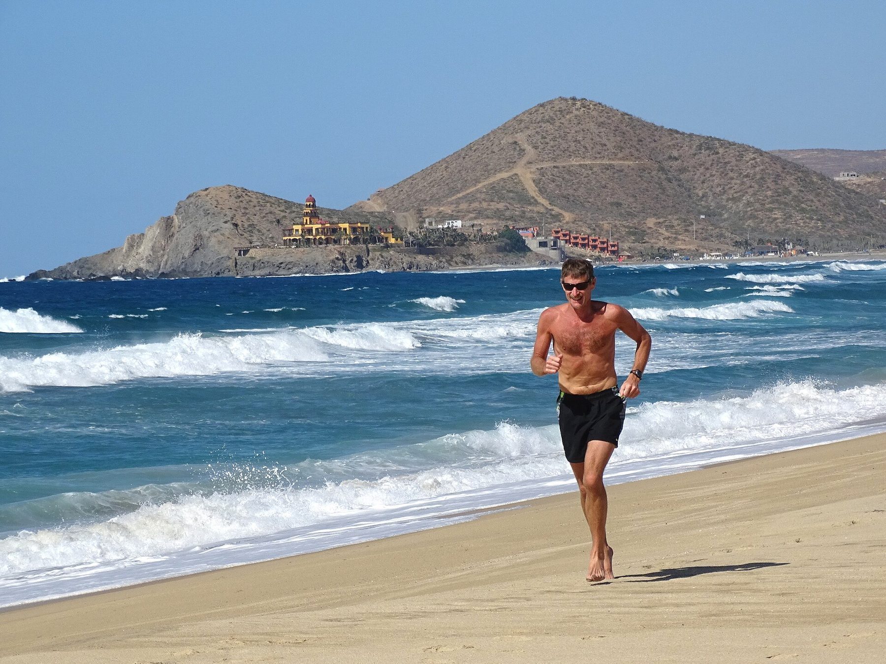 Outdoor yoga retreat at Cerritos Beach with Pacific Ocean view and morning light