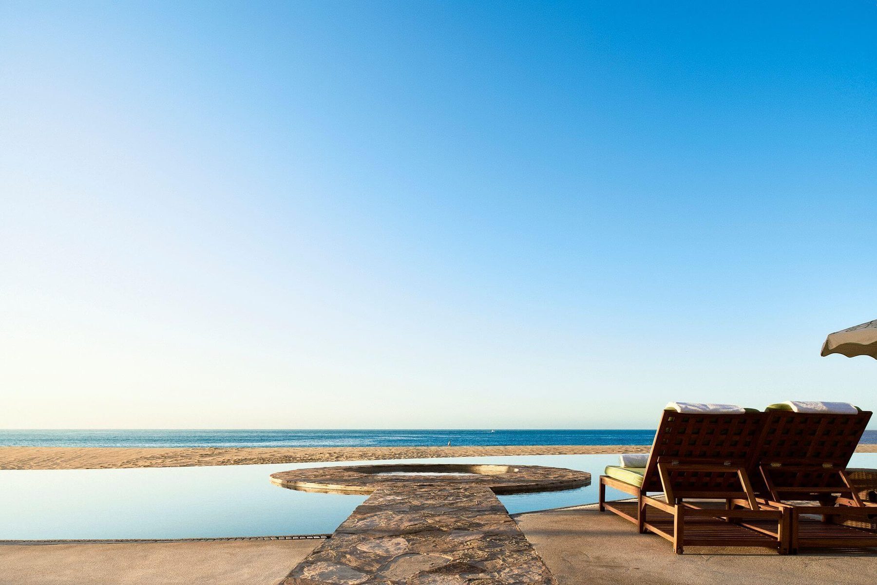 Infinity pool at a Pedregal Cabo San Lucas estate overlooking the Pacific Ocean and Land's End