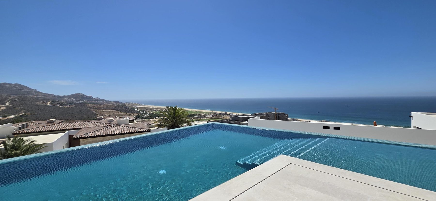 Vacation rental pool with Pacific ocean view at Quivira Cabo San Lucas condo