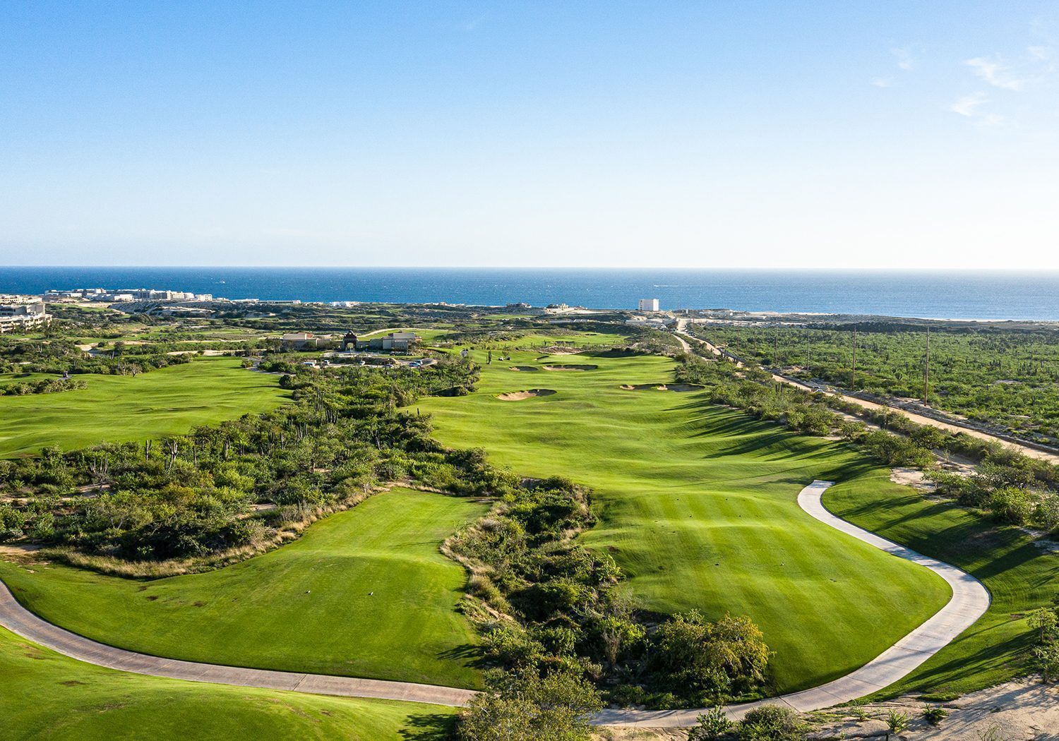 Diamante Cabo San Lucas community aerial view with Pacific coastline and golf course